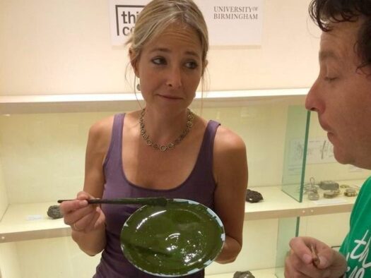 Jon offers a plate of Marmite to broadcaster Alice Roberts who offers him paint in return.